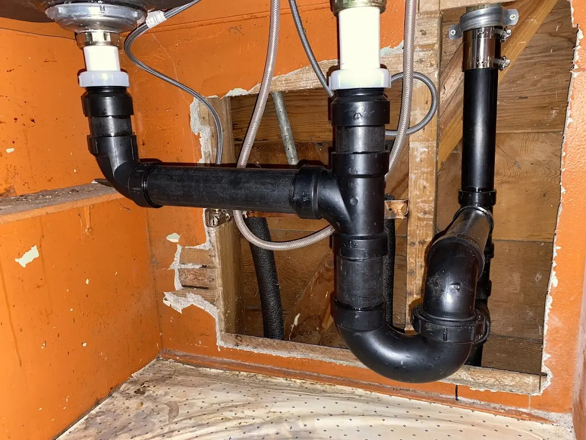 Professional Garbage Disposal Repair equipment and tools on the job in East Rockaway